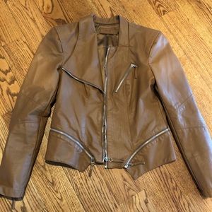 a brown leather vest